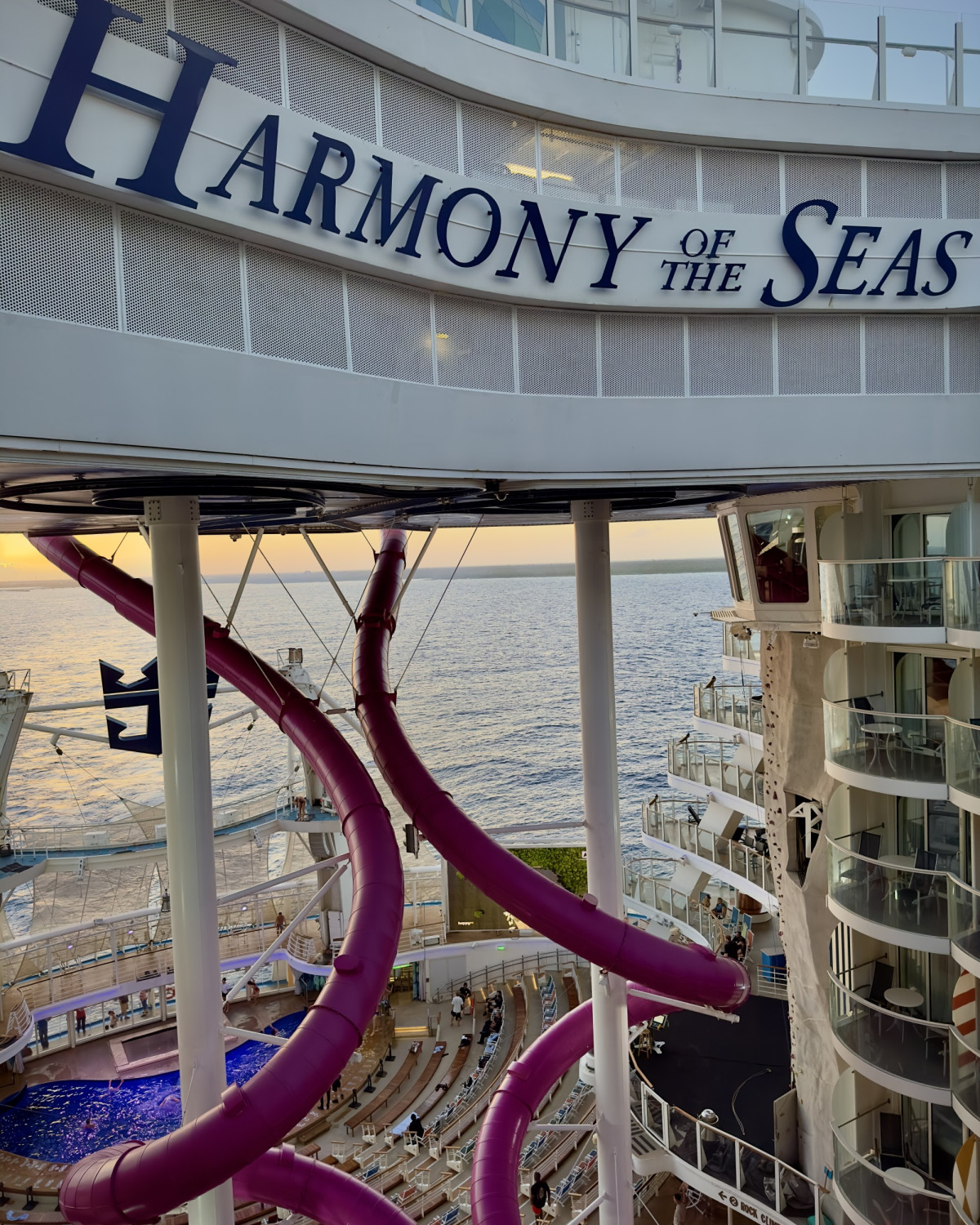 A sign reading "Harmony of the Seas" on a cruise ship