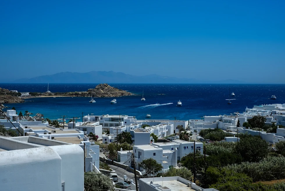white buildings next to body of water during daytime