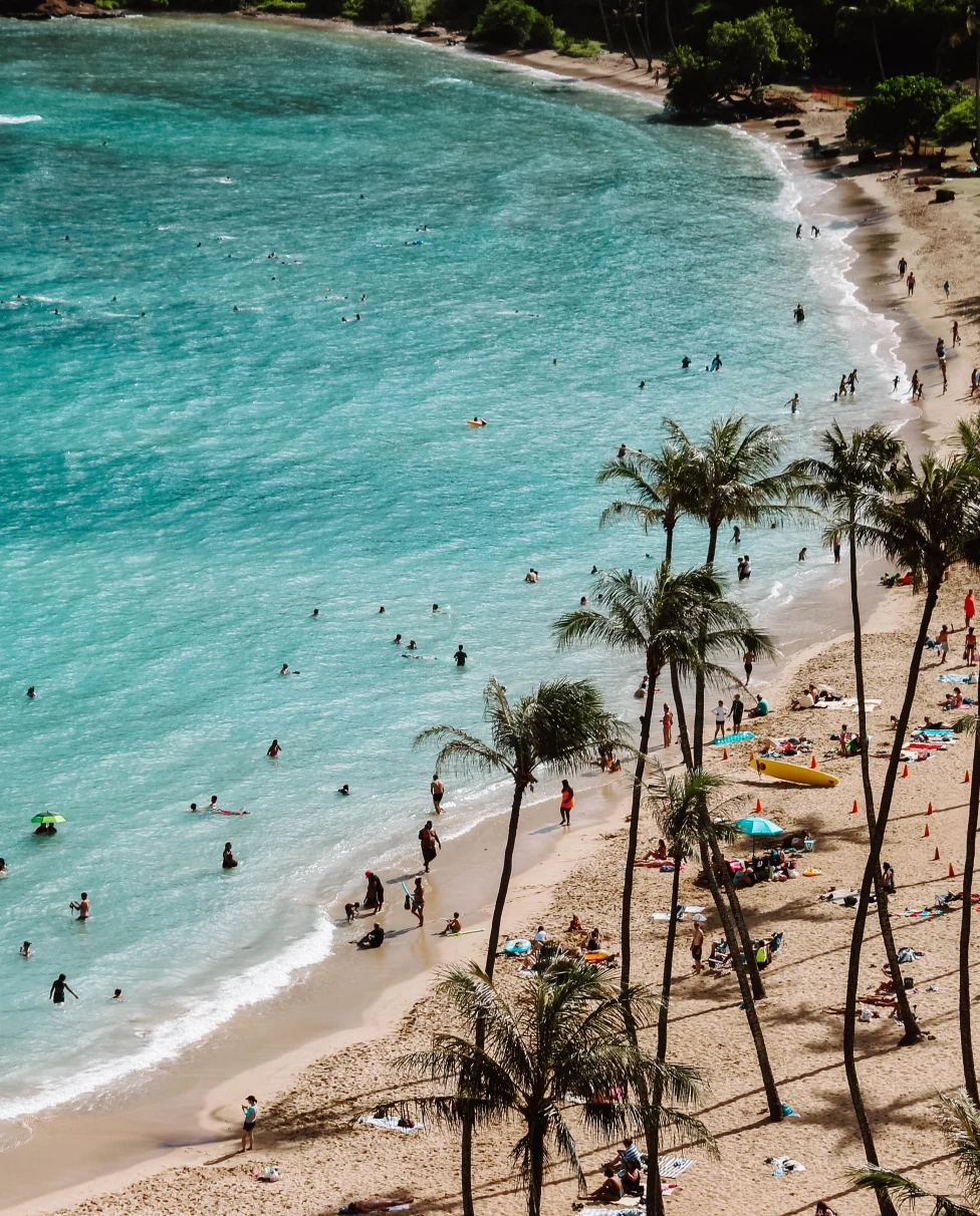 A beautiful beach with people in Oahu, Hawaii. 
