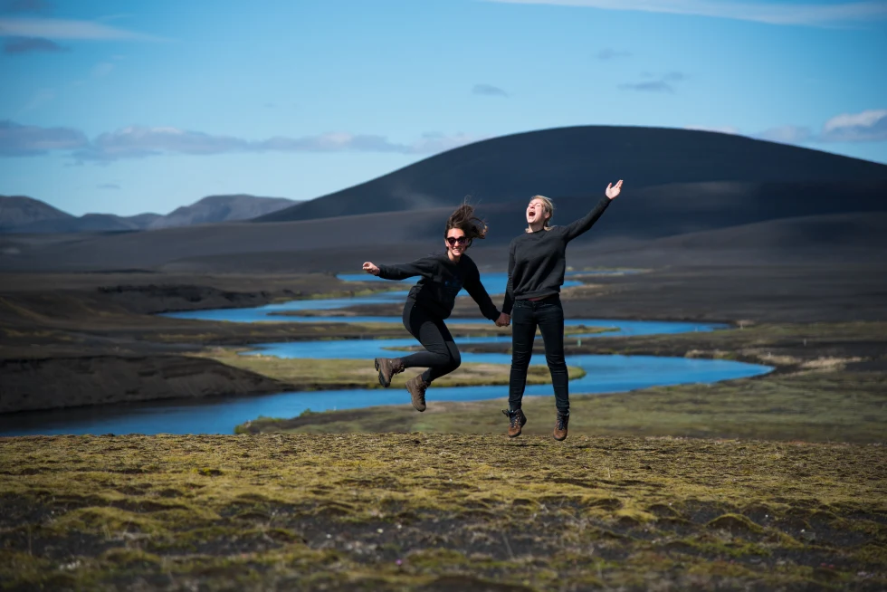 A couple marveling the landscape in Iceland. 