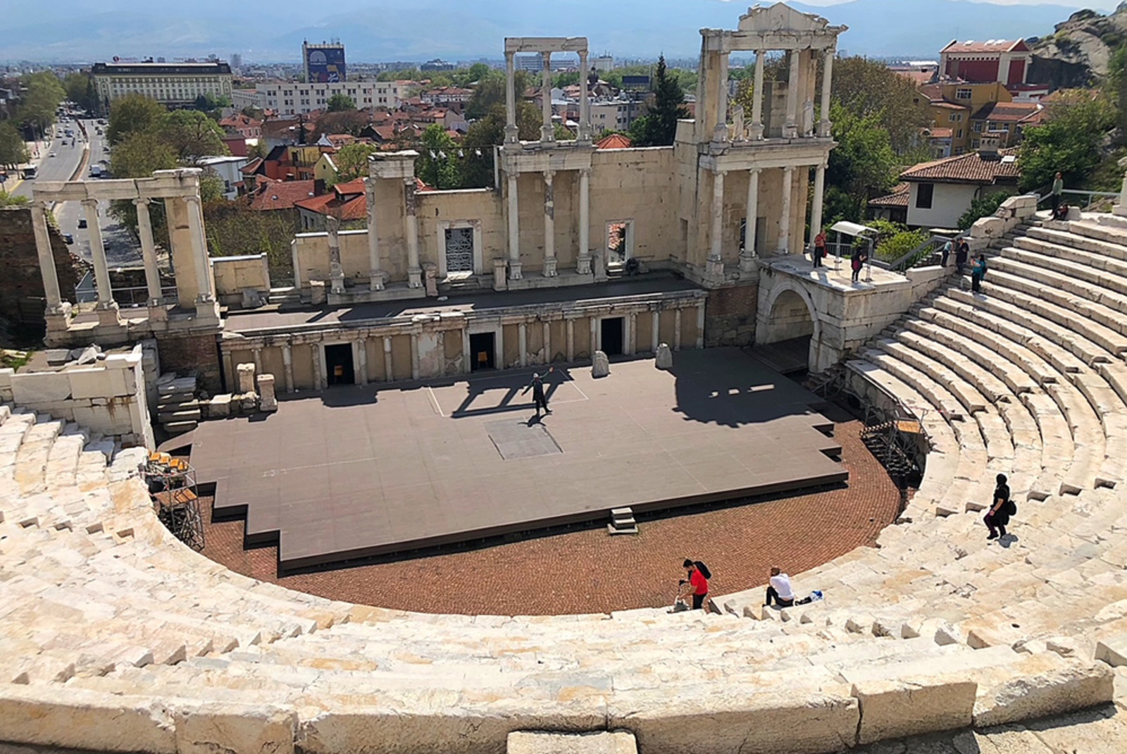 Sofia Bulgaria stone stairs ruins amphitheater small stage city view and mountains 