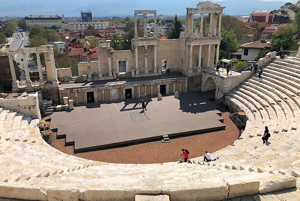 Sofia Bulgaria stone stairs ruins amphitheater small stage city view and mountains