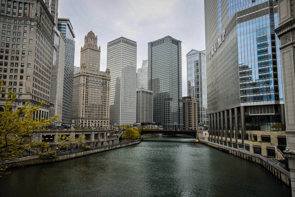 Body of water lined by tall buildings during daytime