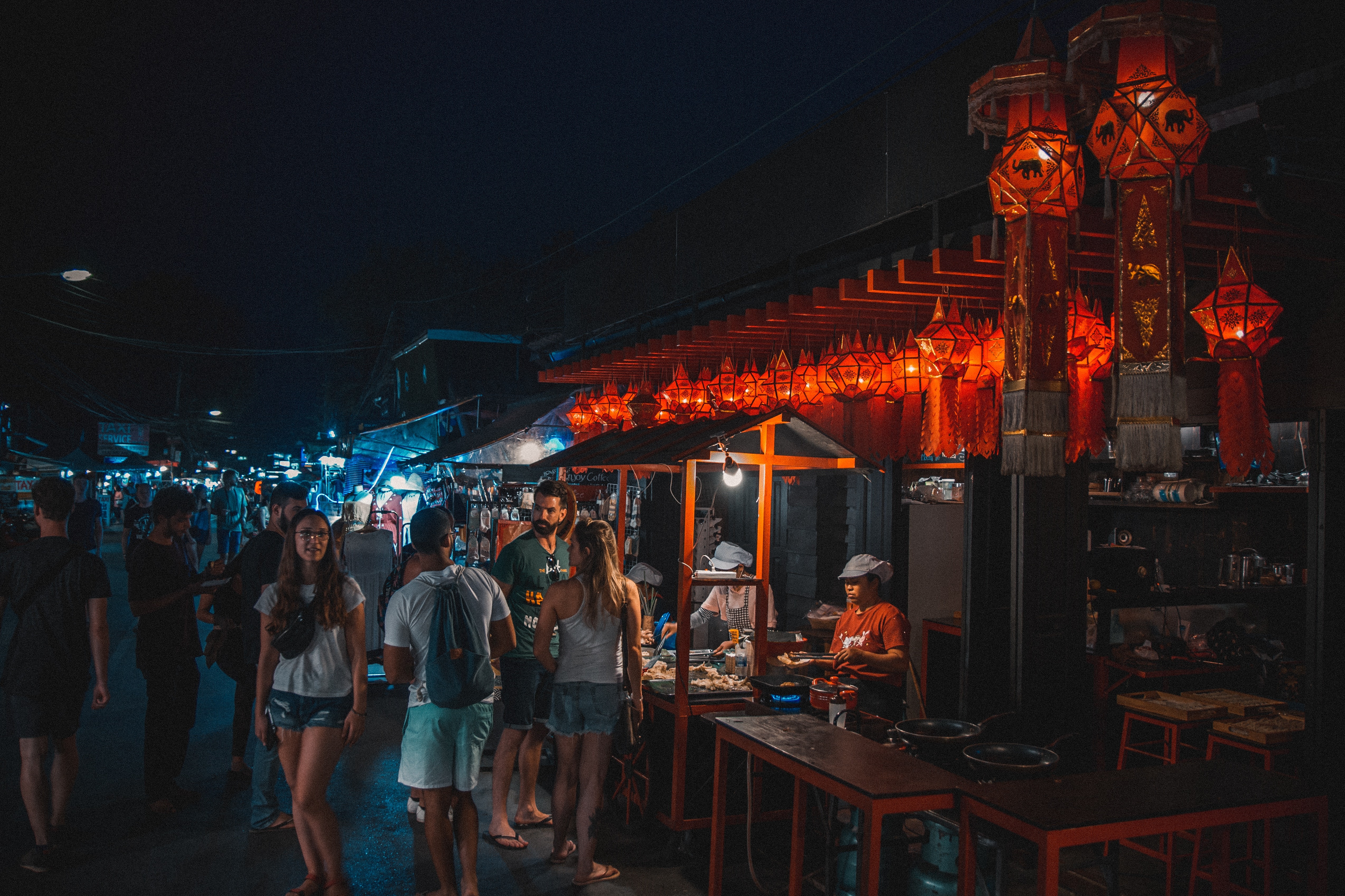 Night view o people buying street food from stalls
