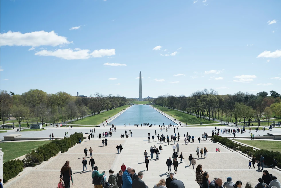 Washington DC Mall monument with crowds of people on a sunny day