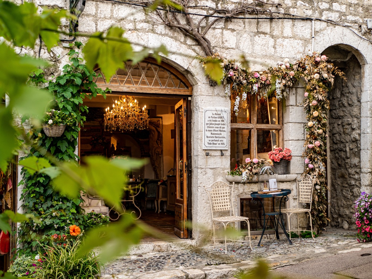Charming cafe on a cobblestone street in the South of France. 