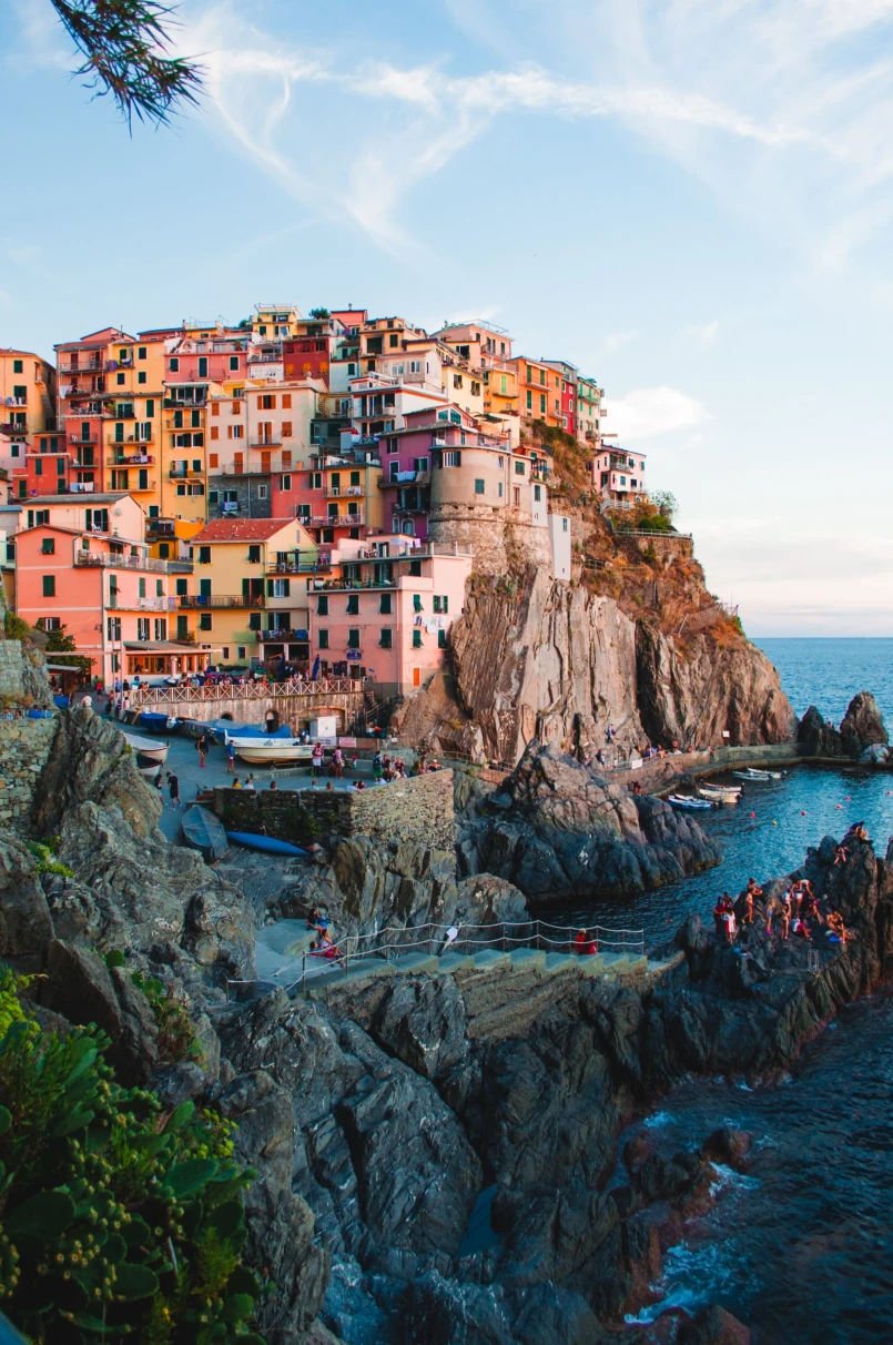 a colorful city perched atop the hillside of an island