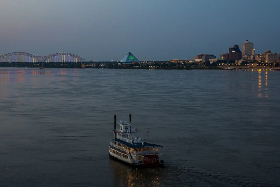 cityscape over river at dusk