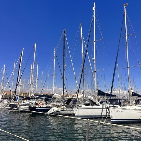 Row of boats ready for cruise at a marina in Barcelona.