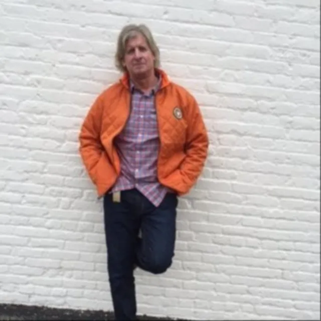Bill Cochrane in an orange jacket