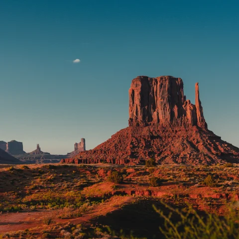 A rock mountain in the sunset.