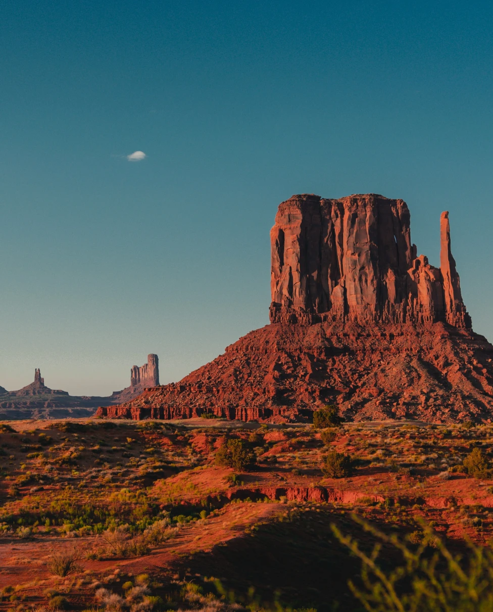 A rock mountain in the sunset.