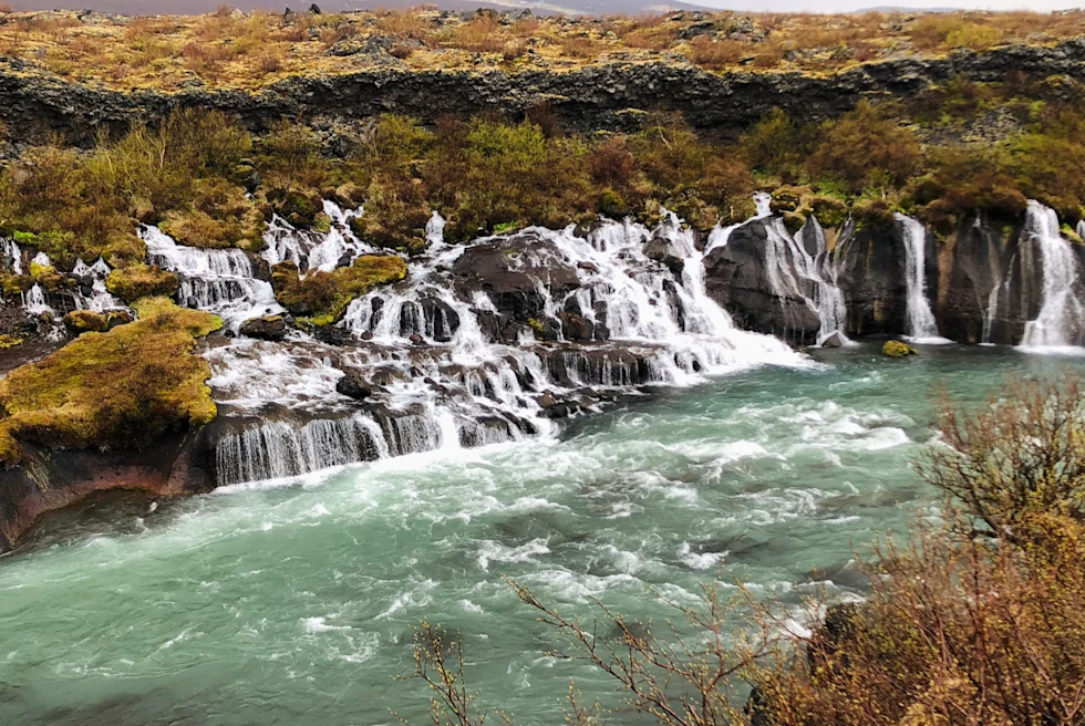 Small waterfalls in green water.