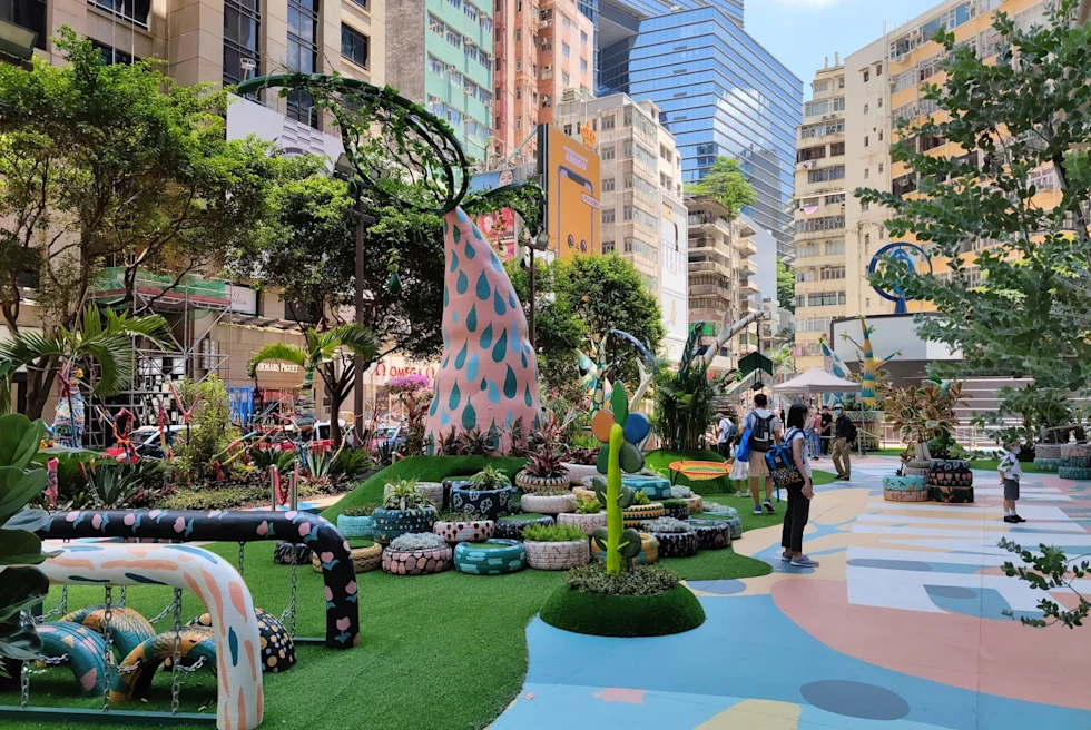 A colorful park among buildings.