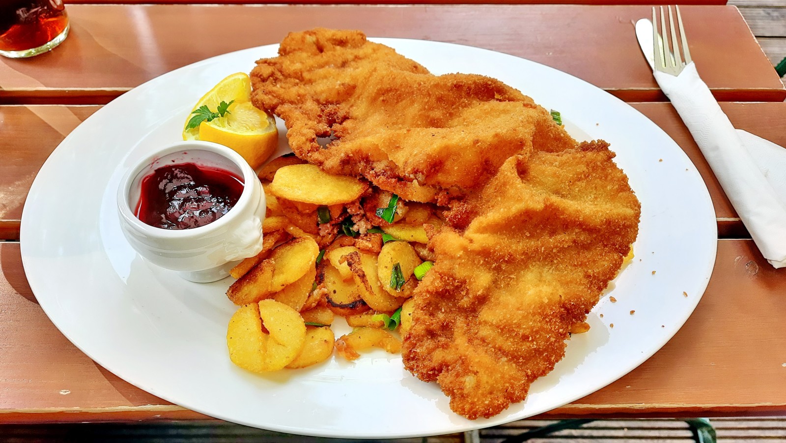 Schnitzel on a white plate with potatoes