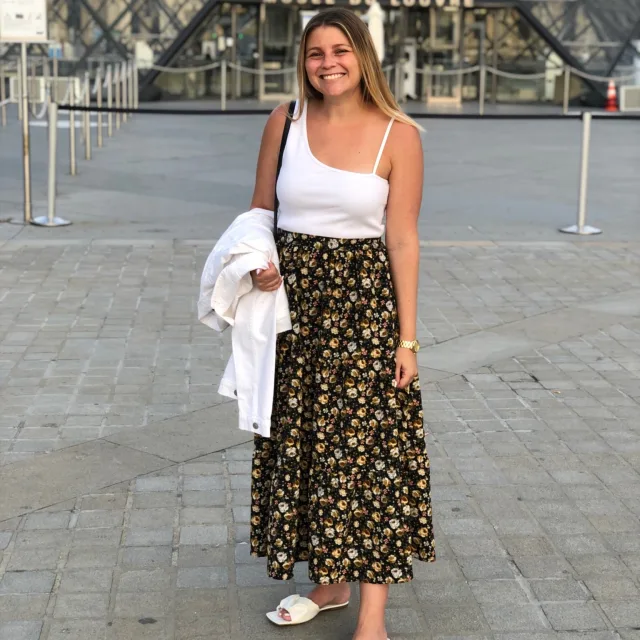 Travel Advisor Amanda Satsky in white blouse and long skirt. 