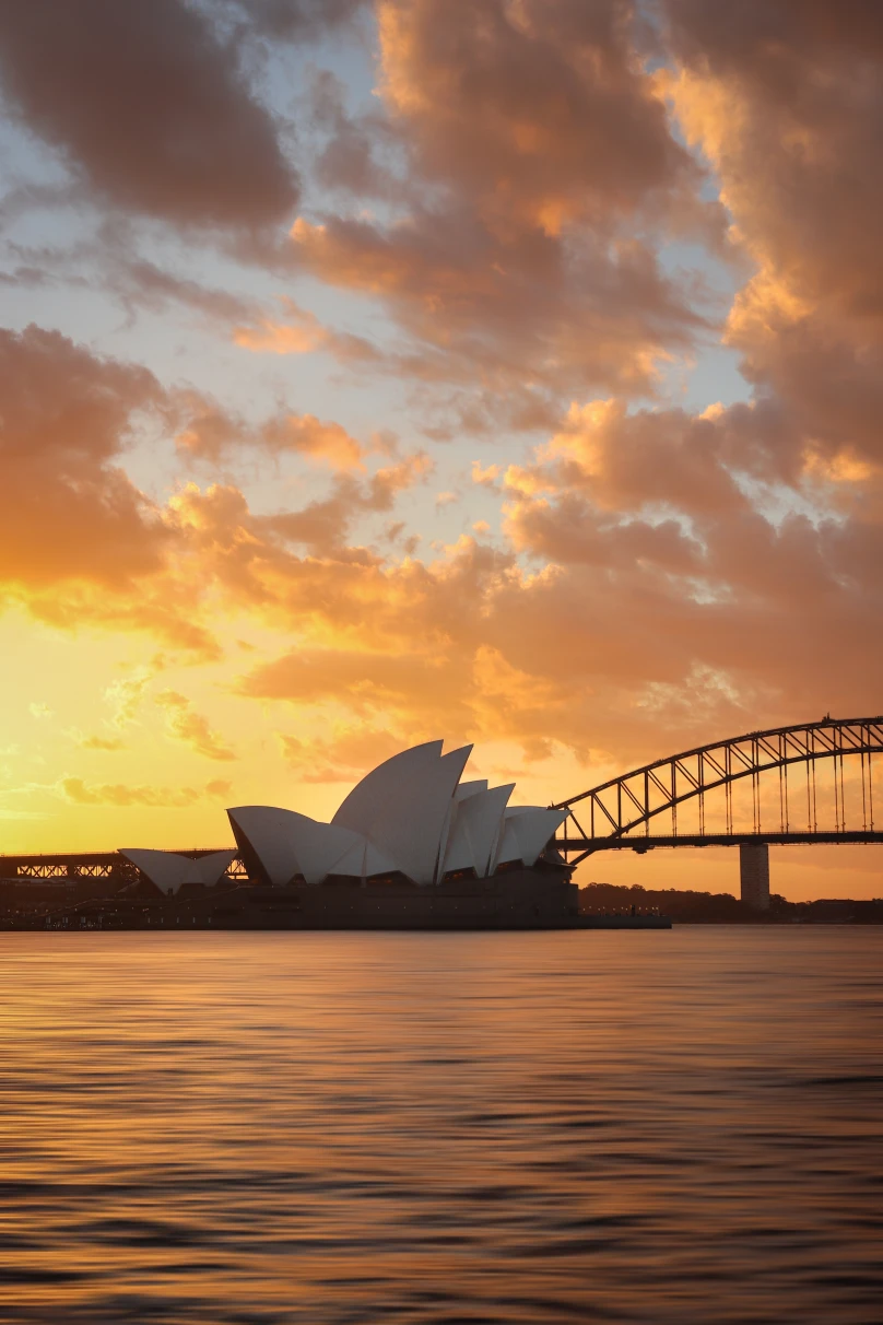 A picture of the Sydney Opera House at sunset. 