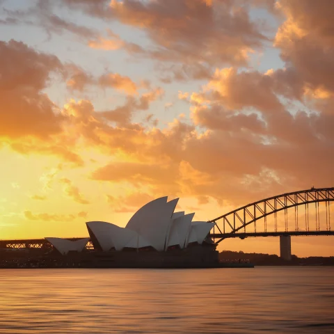 A picture of the Sydney Opera House at sunset. 