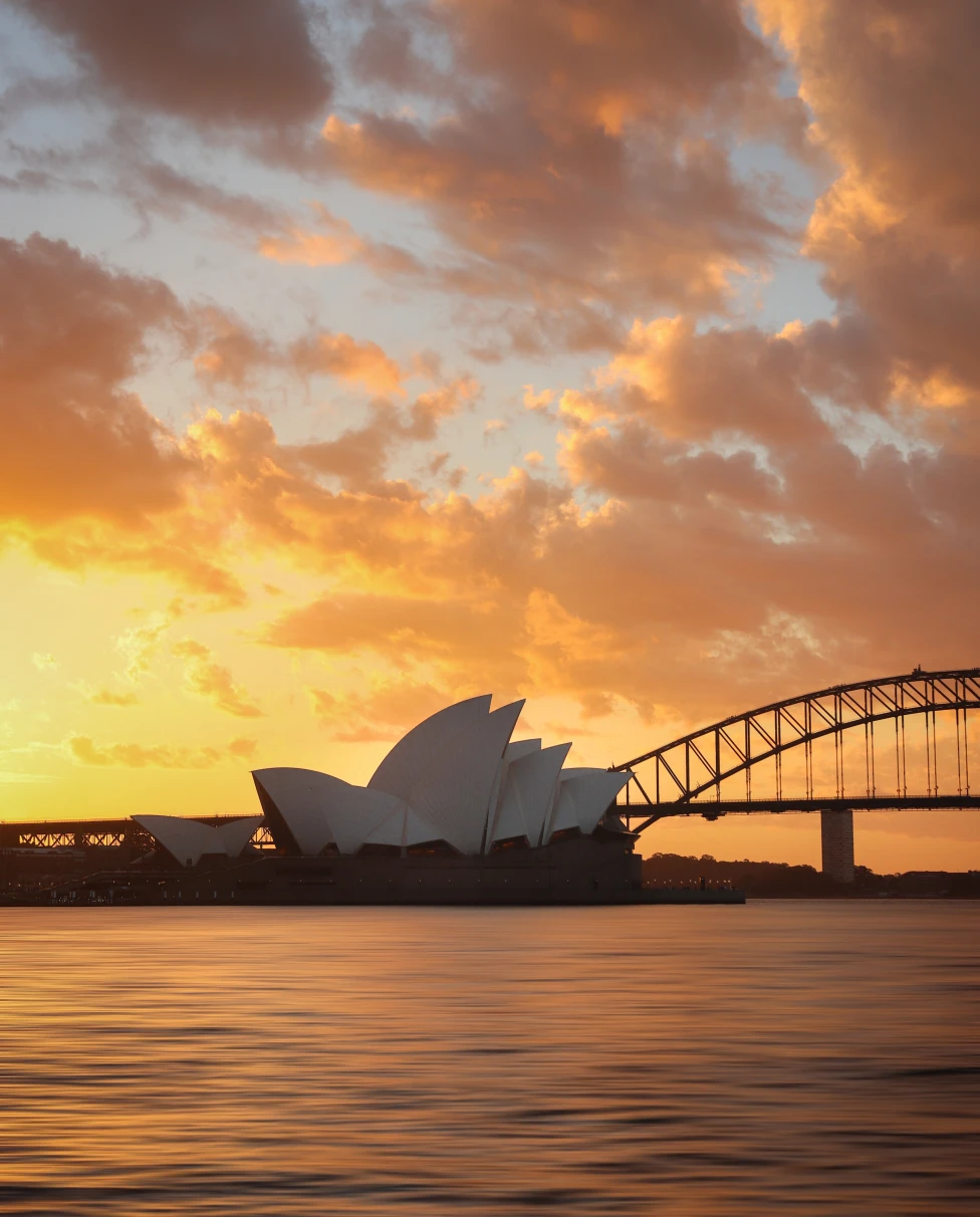 A picture of the Sydney Opera House at sunset. 
