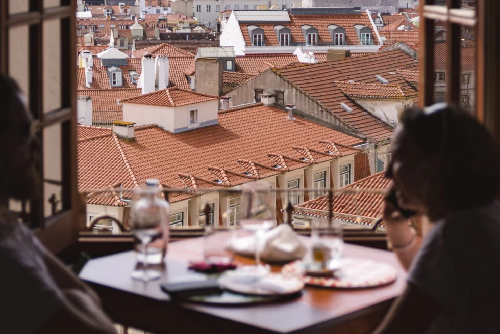 open window overlooking the tiled rooftops of Lisbon