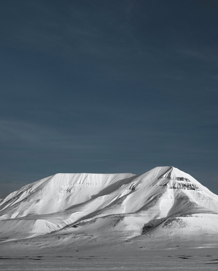 Snowy-capped mountain during nighttime