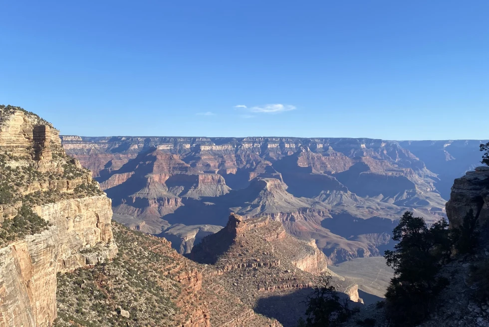 Red cliffs and canyons with blue skies during daytime