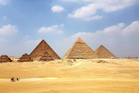 Egyptian pyramids on a yellow sandy desert on a sunny day