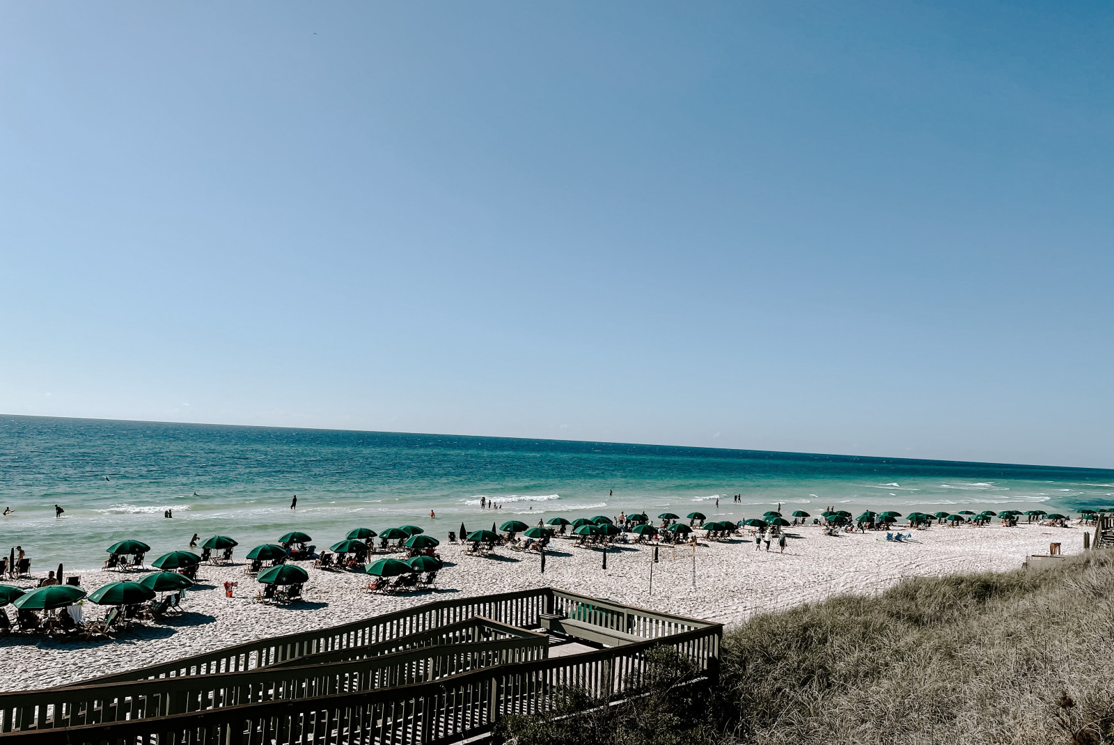 beach chairs and umbrellas on the beach during daytime