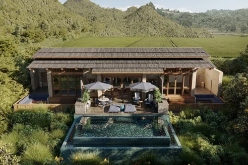 aerial view of a villa with a private plunge pool amid lush greenery