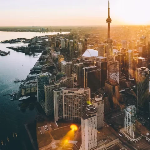 Aerial view of Toronto city skyline during orange hour.