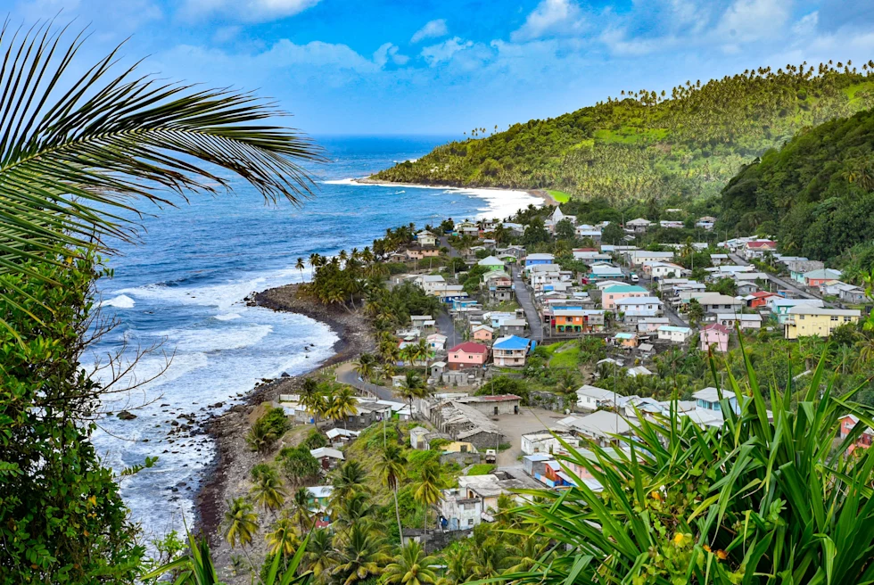 View of small town between the ocean and mountains