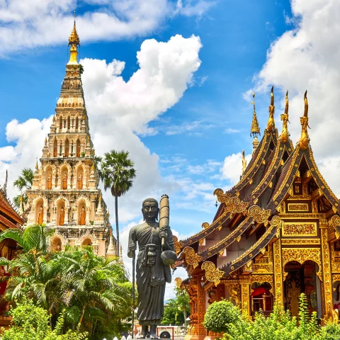 Thailand's traditional buildings with a statue in between