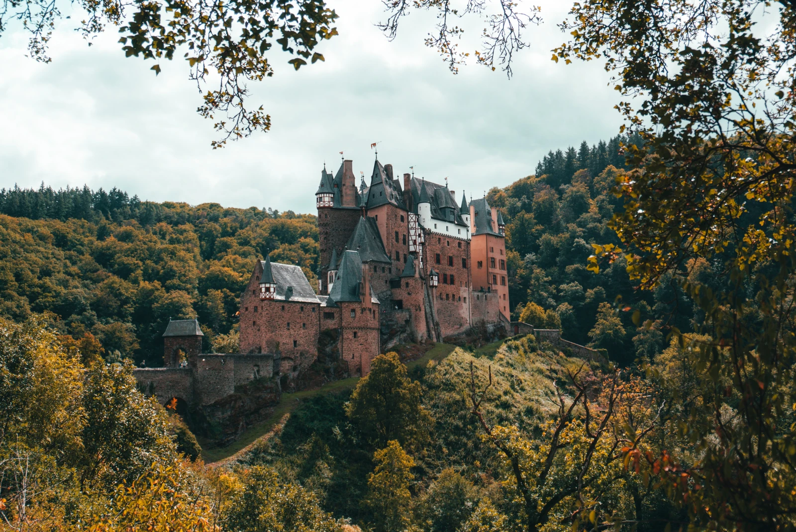 Eltz castle perched on a hill surrounded by trees in Germany