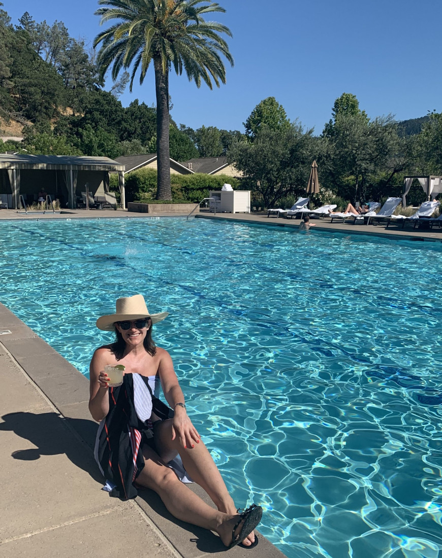 Travel advisor posing beside the beach