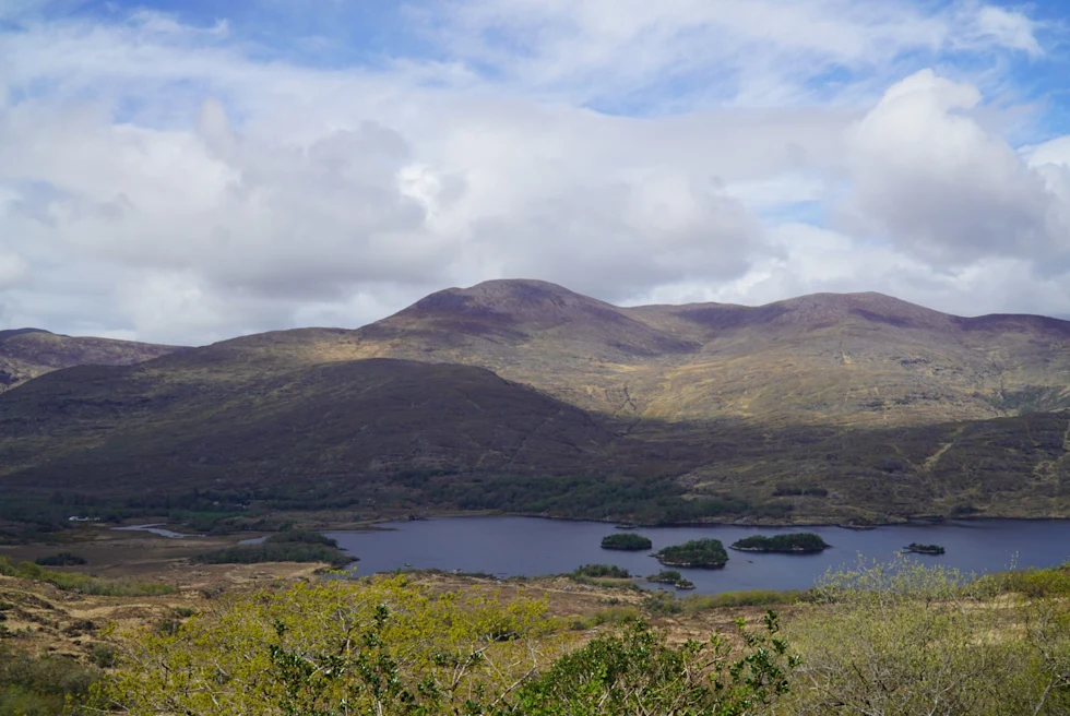 landscape mountains, fields and lake