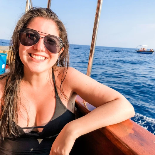 Travel advisor Katerina Randazzo cruising in black top and sun glasses.