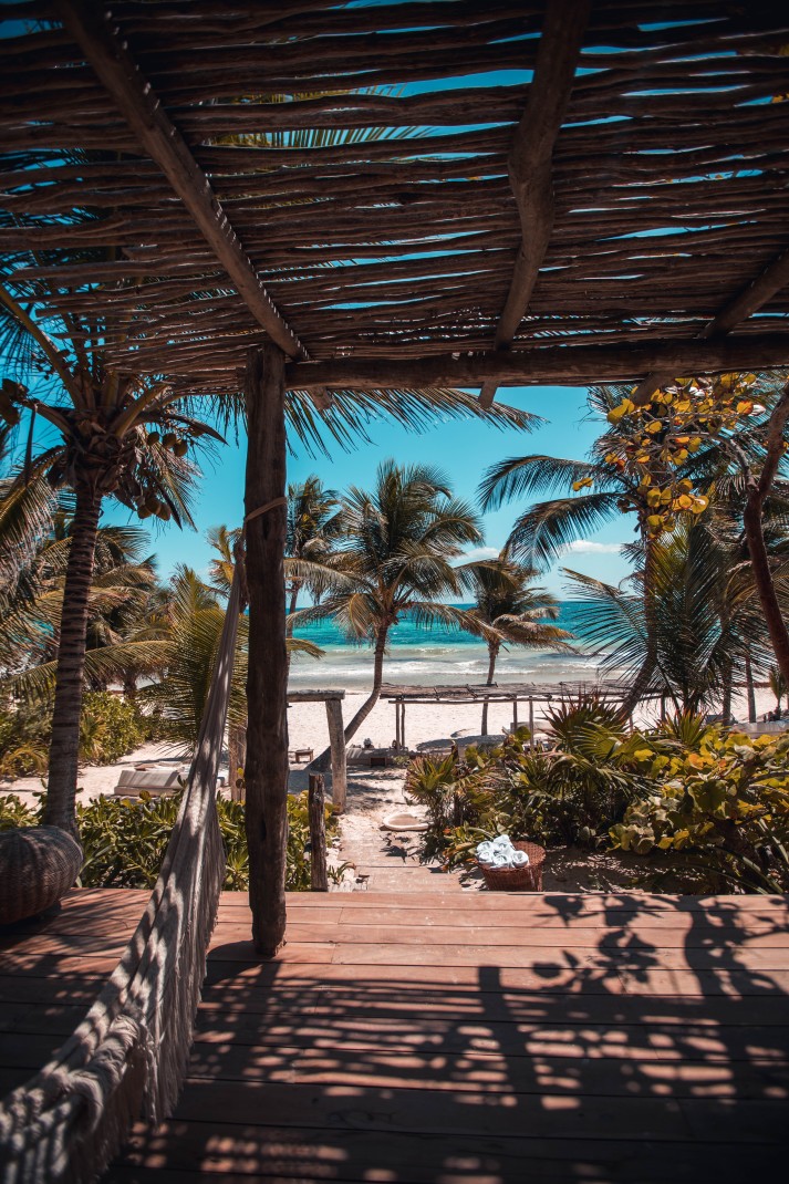 Covered deck with beach in the background in Tulum