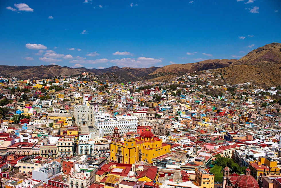 Aerial view of city with colorful buildings.