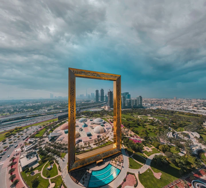 Giant gold frame in Dubai with the city in background