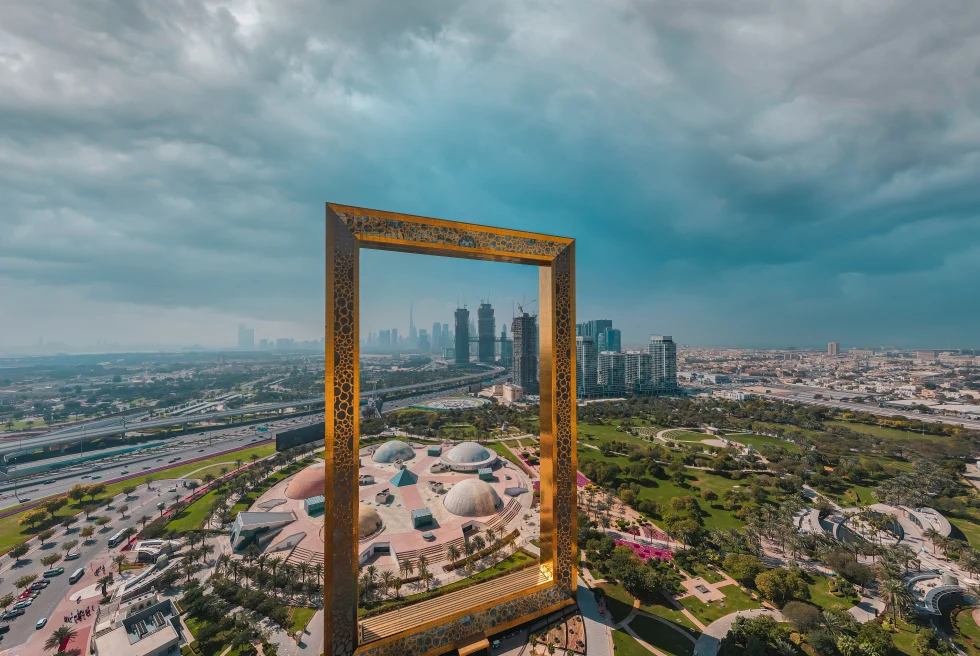 Giant gold frame in Dubai with the city in background