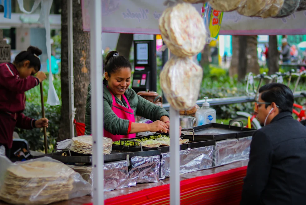 Woman cooking on a cooktop during daytime