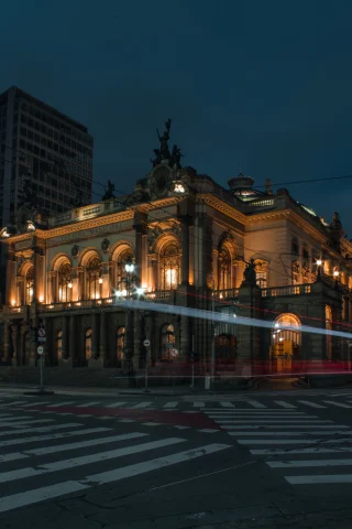 A picture of illuminated municipal theatre in Sao Paulo at night time.