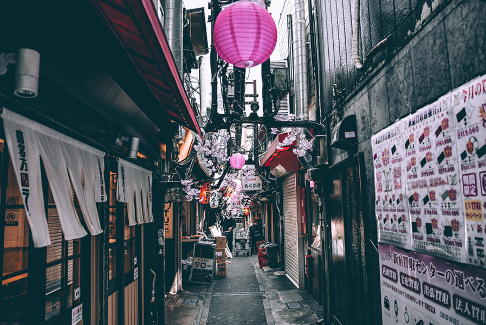 pink lantern in Japanese street with white flyers and grey concrete streets