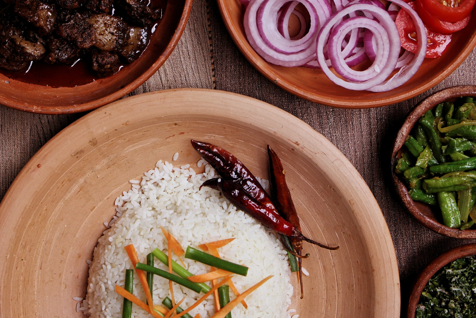 Plate of rice and vegetables on a wooden table