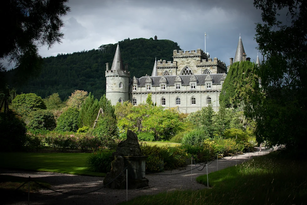 A white castle surrounded with trees.