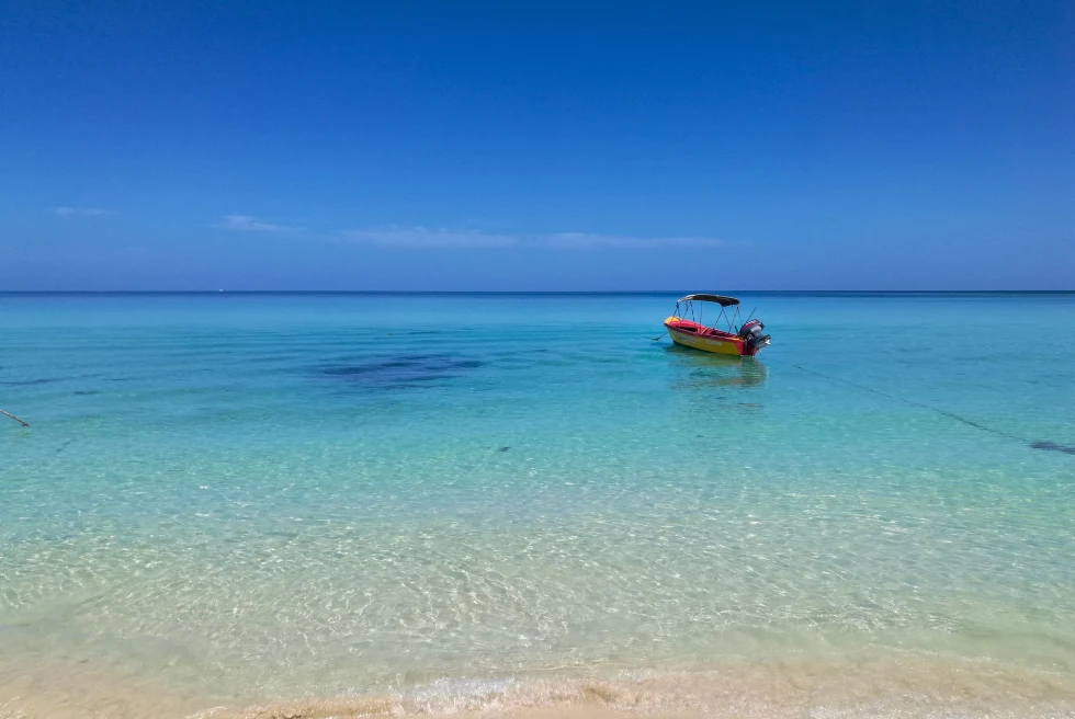 Boat floating in shallow water in Jamaica