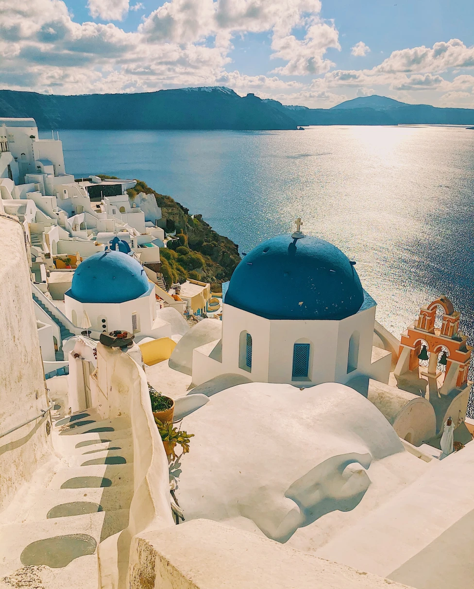 White and blue concrete architecture in Santorini near the sea.