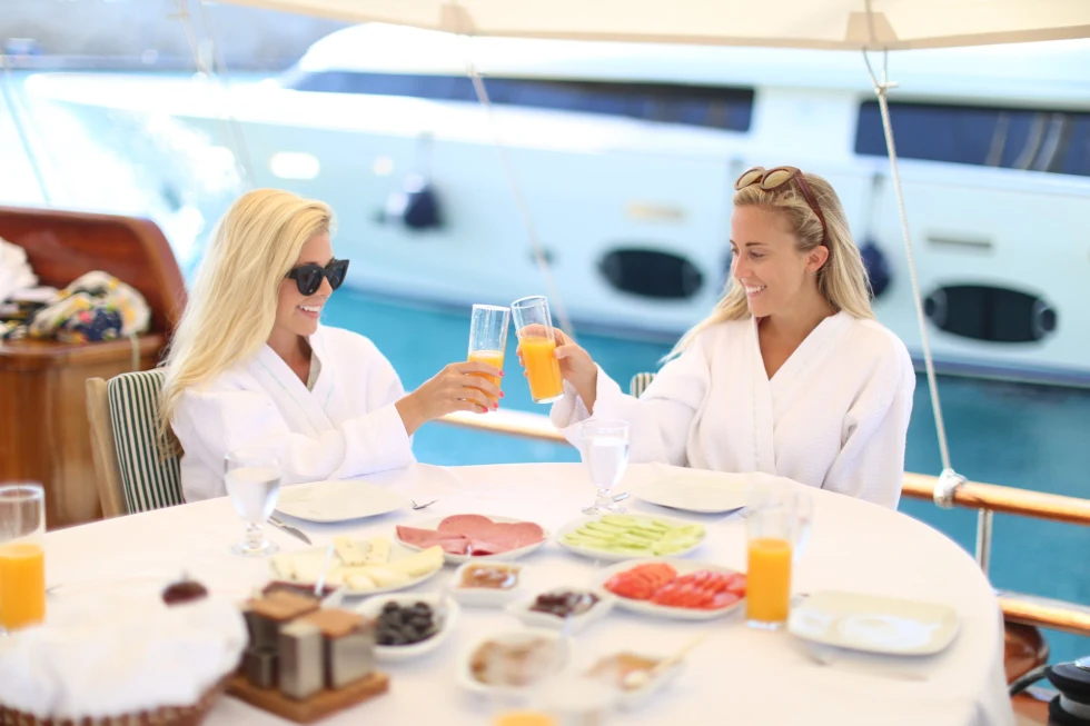 two women having breakfast on aboat 