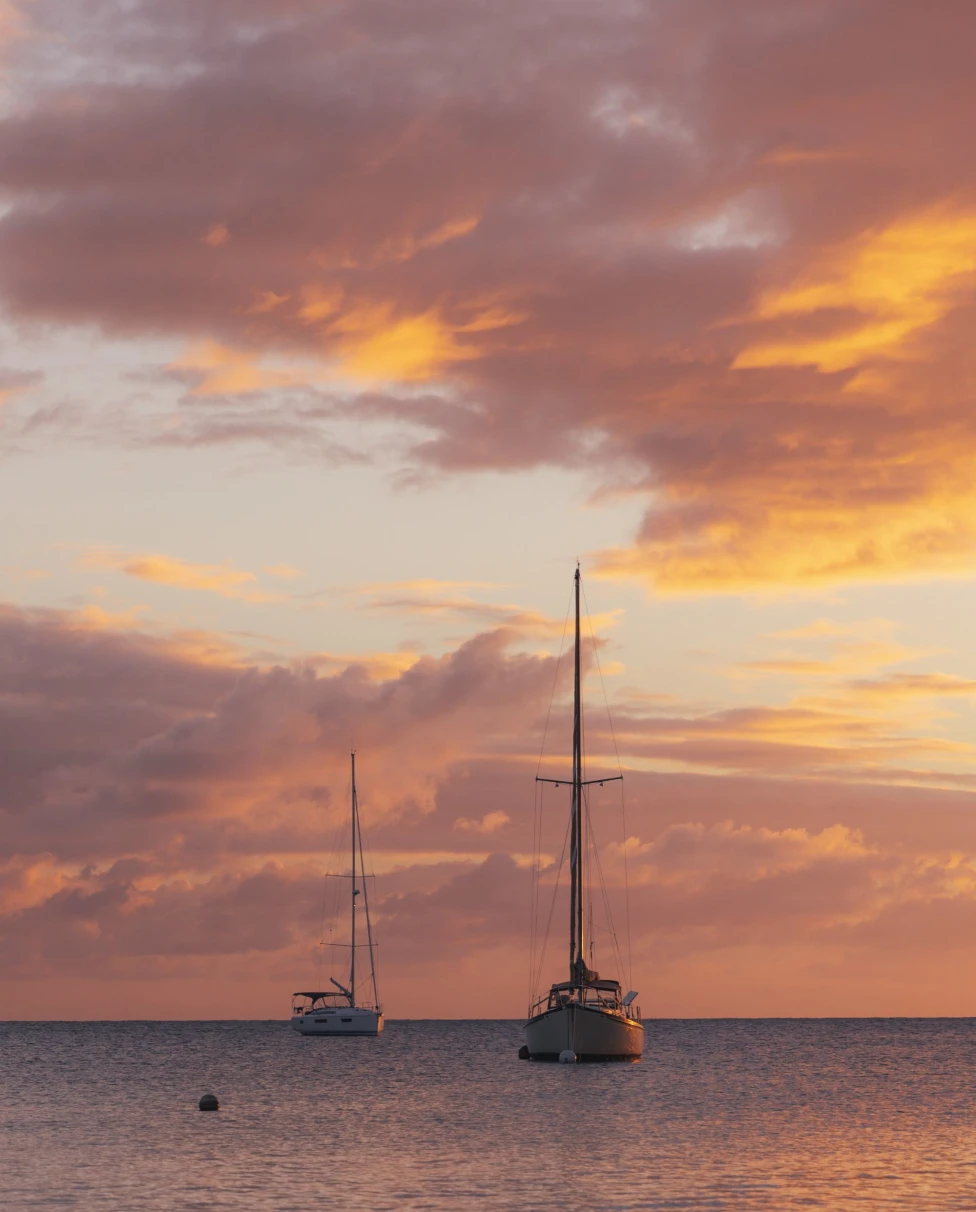 A couple of boats on a body of water.