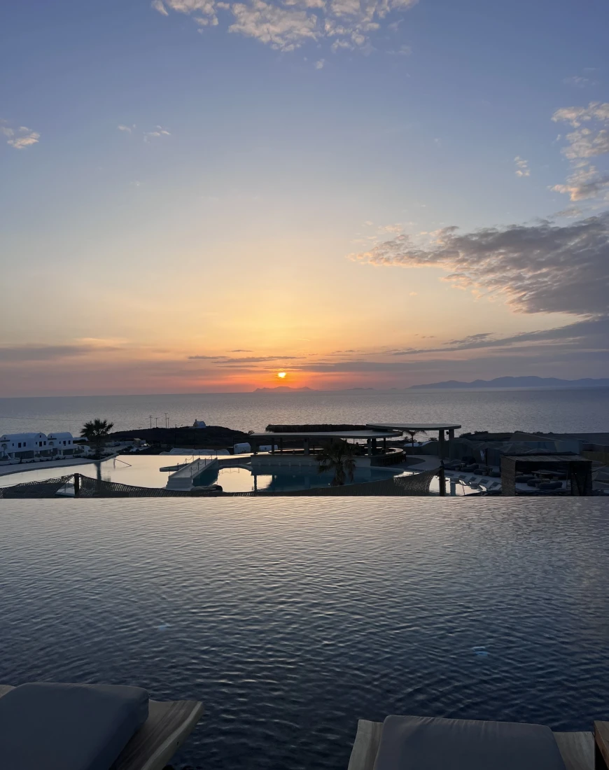 infinity pool overlooking the sea at sunset